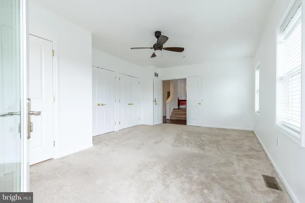 a view of empty room with windows