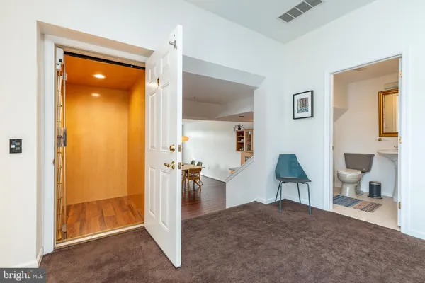 a bedroom with a bed and a view of bathroom