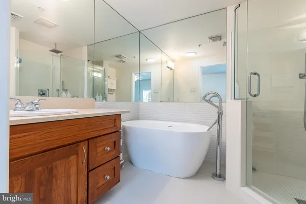 a bathroom with a double vanity sink mirror and double