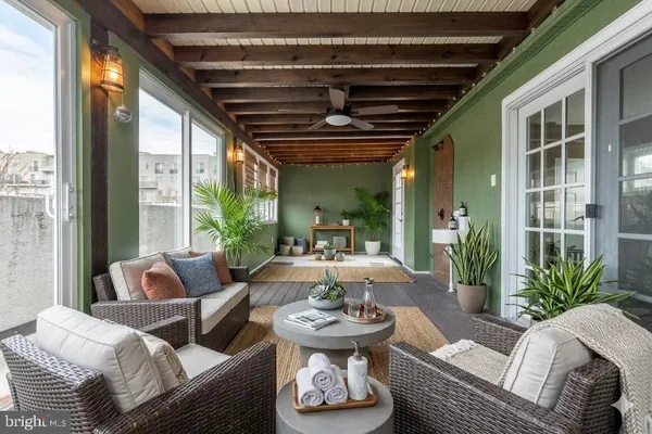 a living room with furniture and a large window