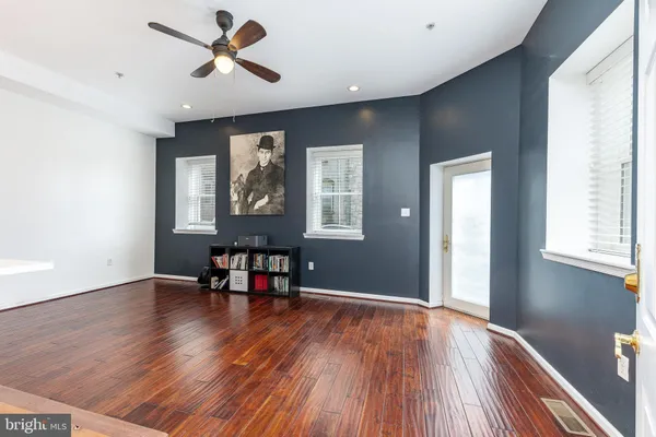 a view of a livingroom with furniture and wooden floor