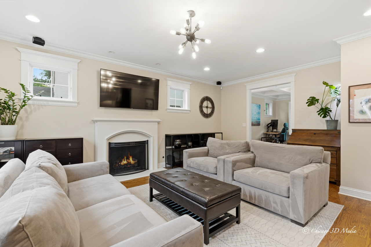 306 17th Street Wilmette, IL 60091 - Photo 46 of 48 a living room with furniture a flat screen tv and a fireplace