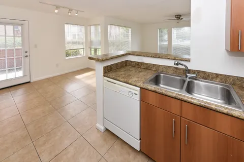 a kitchen with a sink and cabinets