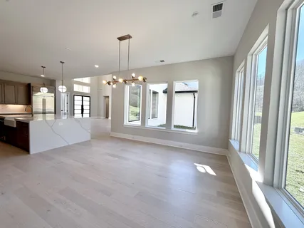 a front view of a house with a large window