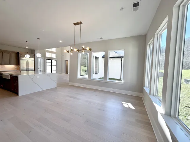 a front view of a house with a large window