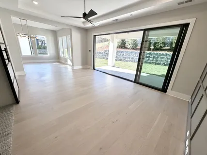 a large bathroom with a sink a vanity and a mirror