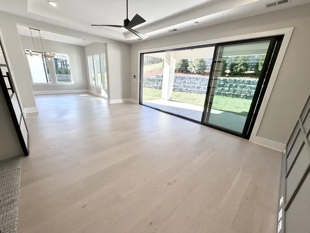 a large bathroom with a sink a vanity and a mirror