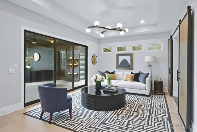 a large kitchen with stainless steel appliances kitchen island granite countertop a refrigerator and a sink