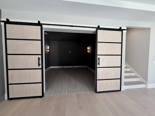 a bathroom with a double vanity sink mirror and bathtub