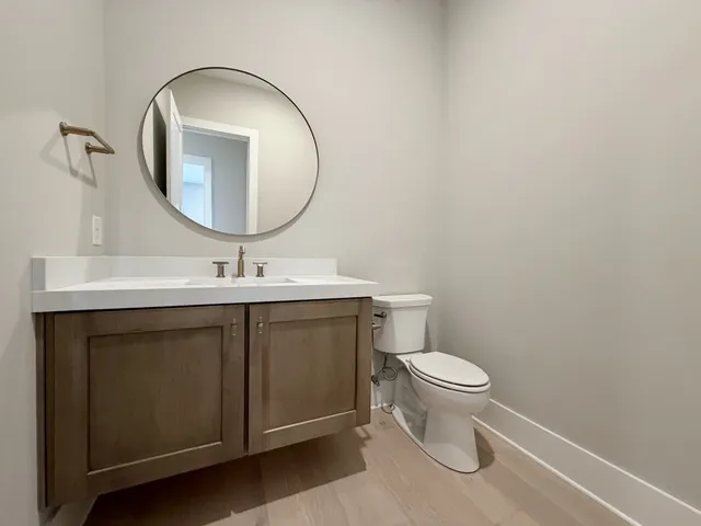 a living room with furniture a large window and a chandelier