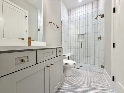 a bedroom with a bed and painting on the wall