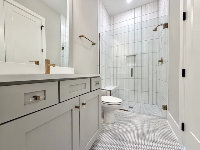 a bedroom with a bed and painting on the wall