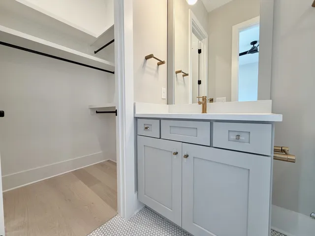 a bathroom with a sink toilet tub and shower