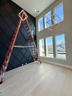 a large kitchen with stainless steel appliances kitchen island granite countertop a large counter top and wooden floors