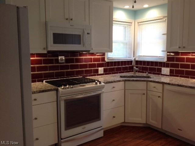 Newly-remodeled kitchen featuring new appliances, countertop and cupboards