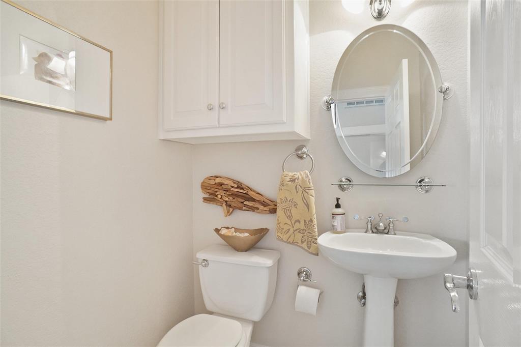 1003 Mesquite Ridge Graford, TX 76449 - Photo 18 of 40 a bathroom with a toilet sink and mirror
