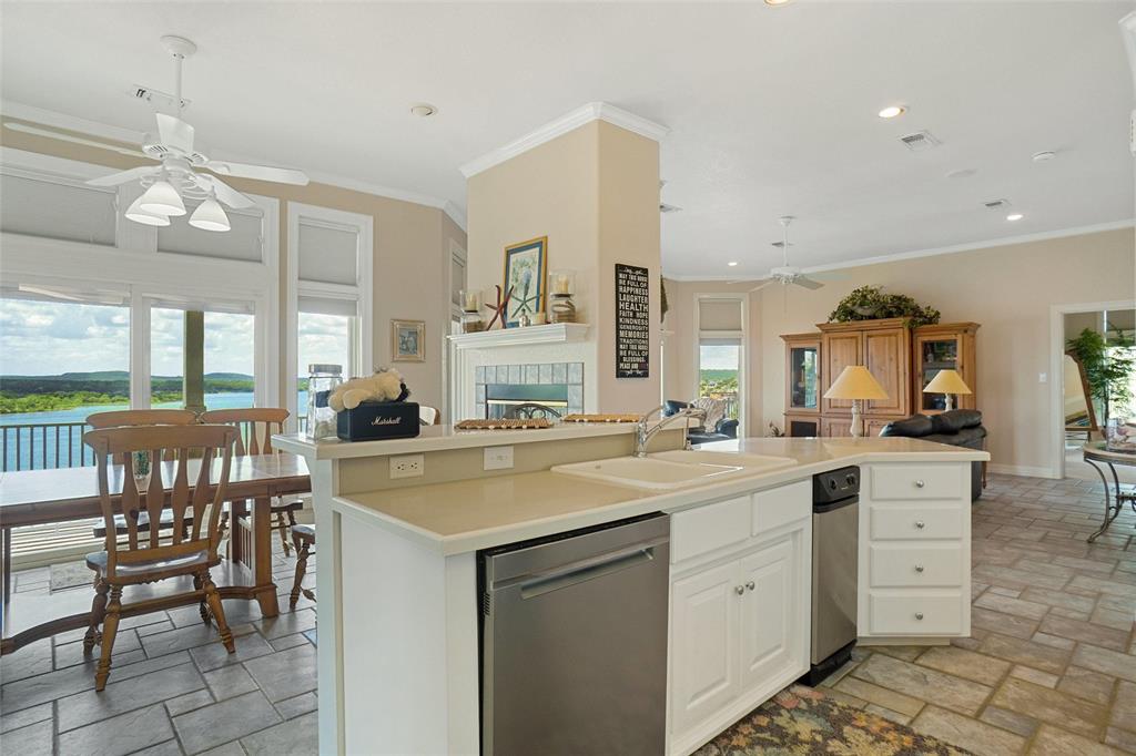 1003 Mesquite Ridge Graford, TX 76449 - Photo 21 of 40 a kitchen with a stove a sink and chairs