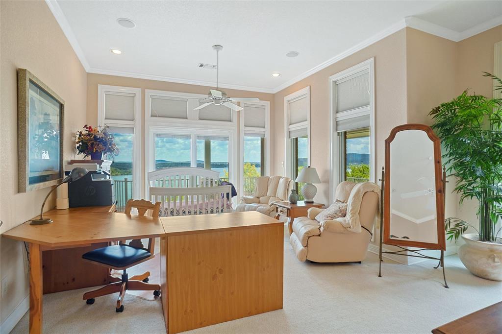 1003 Mesquite Ridge Graford, TX 76449 - Photo 25 of 40 a living room with furniture a fireplace and a potted plant