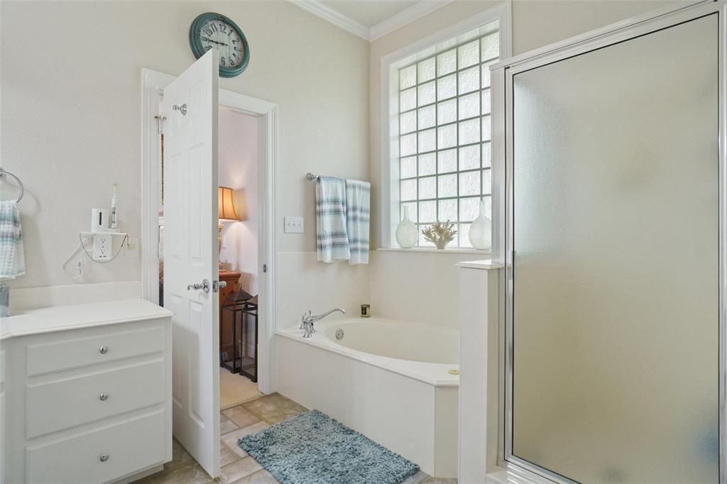 1003 Mesquite Ridge Graford, TX 76449 - Photo 27 of 40 a bathroom with a bathtub and a sink