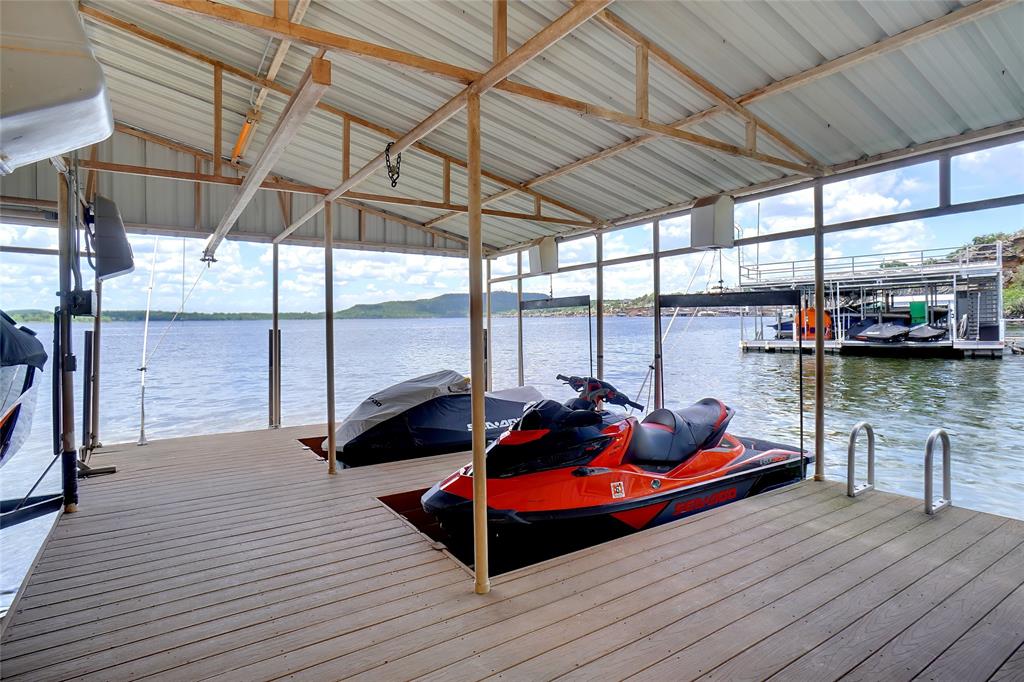 1003 Mesquite Ridge Graford, TX 76449 - Photo 40 of 40 a man sitting on a wooden floor next to a yard