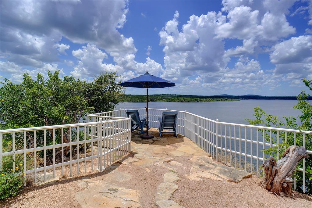 1003 Mesquite Ridge Graford, TX 76449 - Photo 9 of 40 a view of a chair and tables on the roof deck