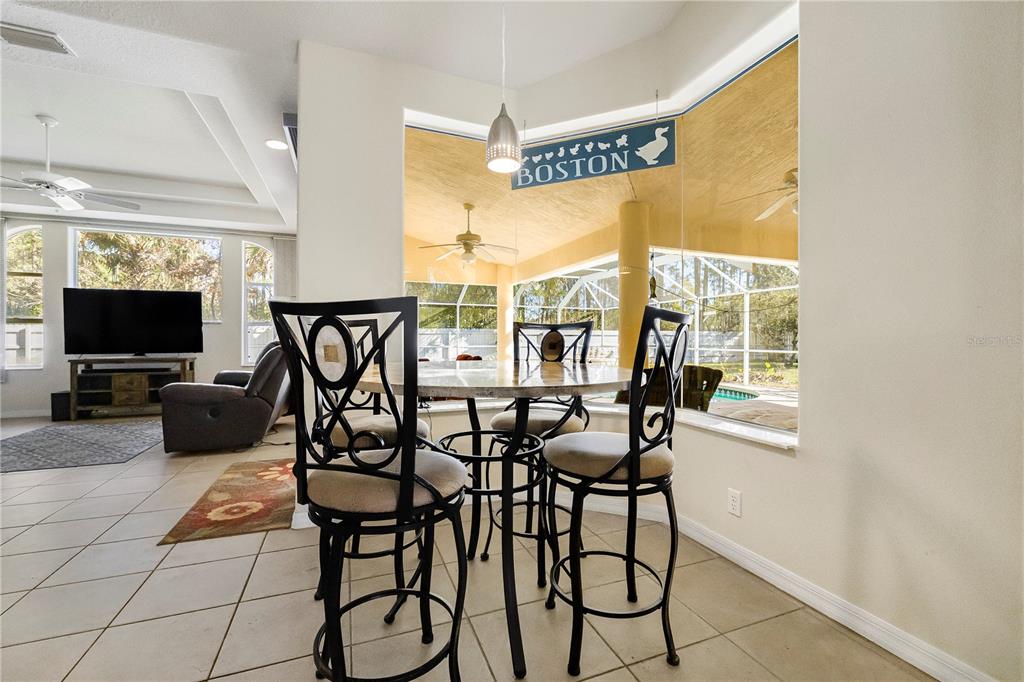 24 Regency Drive Palm Coast, FL 32164 - Photo 14 of 36 a view of a livingroom with furniture and a flat screen tv