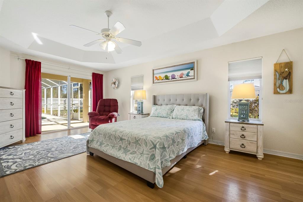 24 Regency Drive Palm Coast, FL 32164 - Photo 18 of 36 a spacious bedroom with a bed and a window