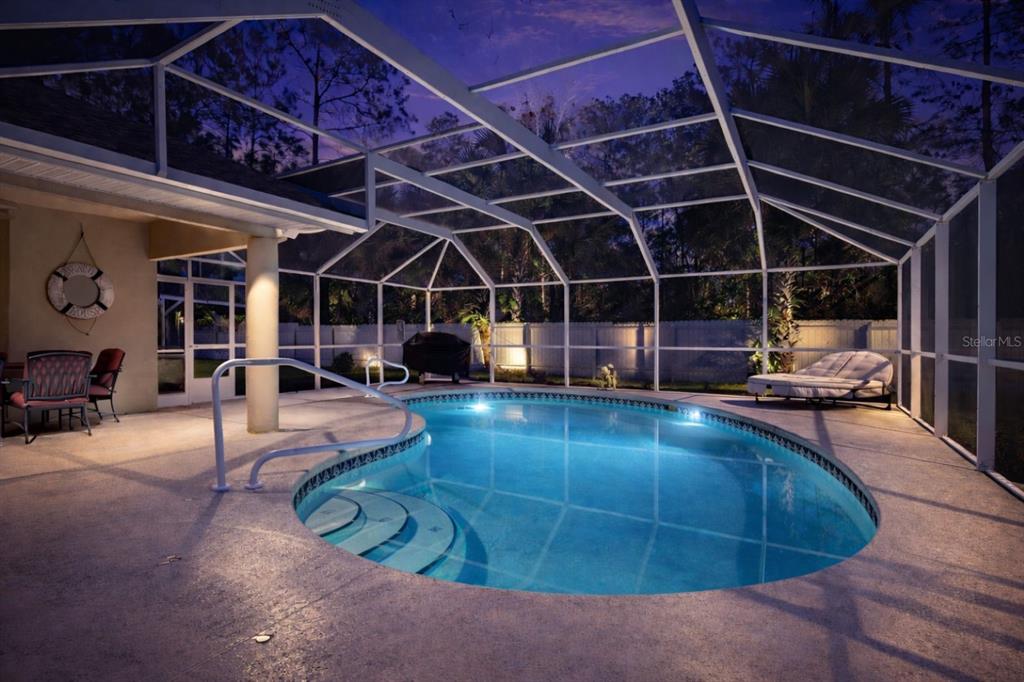 24 Regency Drive Palm Coast, FL 32164 - Photo 27 of 36 a view of a swimming pool with a patio