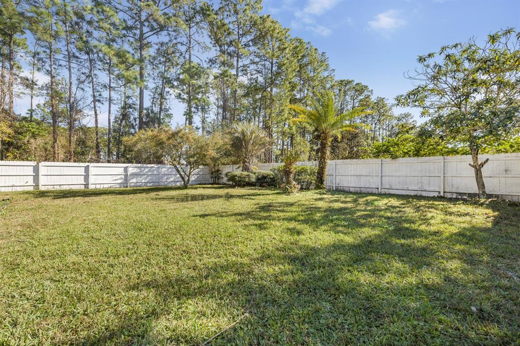 24 Regency Drive Palm Coast, FL 32164 - Photo 31 of 36 a view of an outdoor space and yard