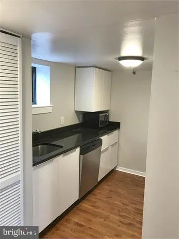 a kitchen with a sink and a stove