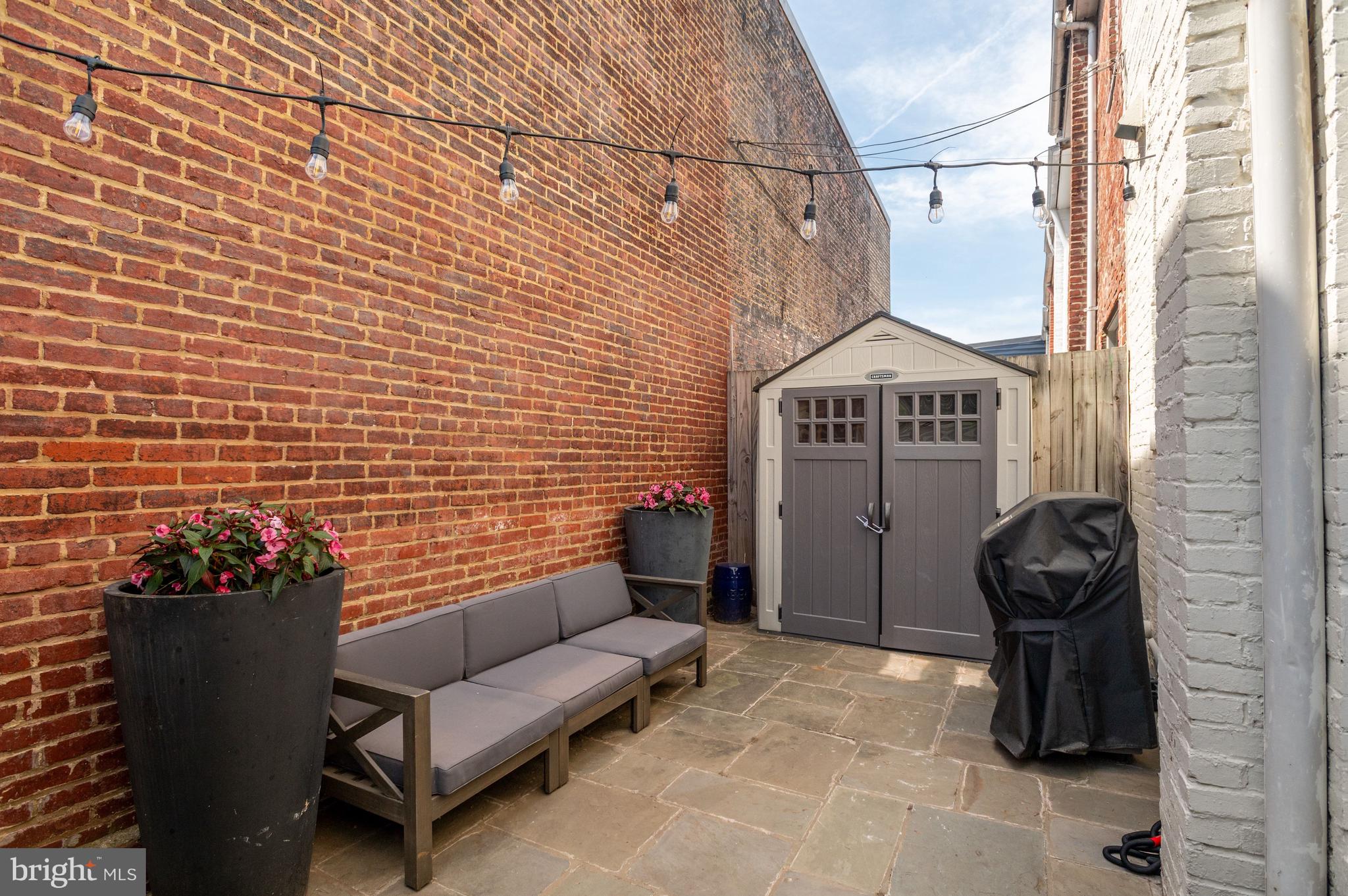 3500 T Street Northwest Washington, DC 20007 - Photo 20 of 22 Rear stone patio with shed