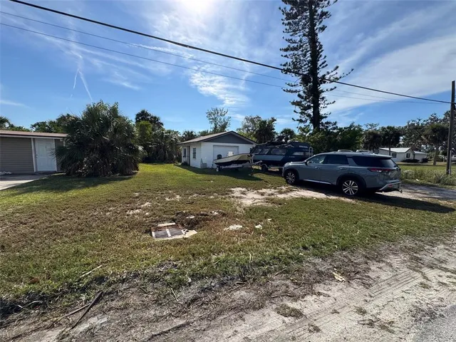 a view of a garden with a house
