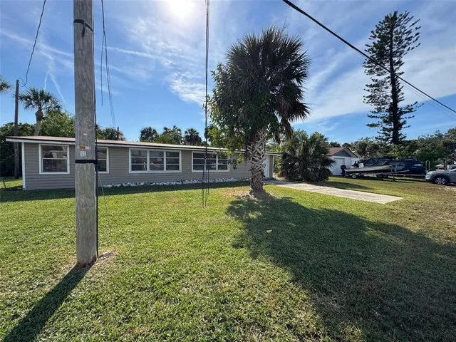 a view of a house with a big yard
