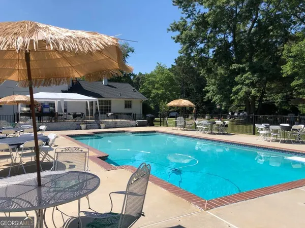 a view of a swimming pool and an outdoor space