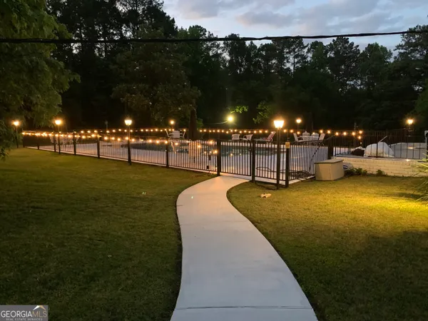 a dinning table and chairs in patio of the house