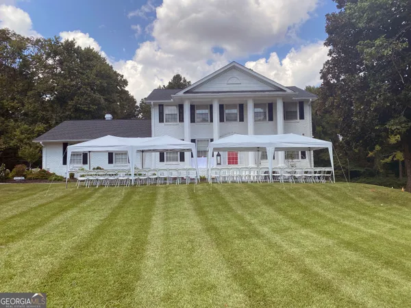 a view of a lake with a big yard