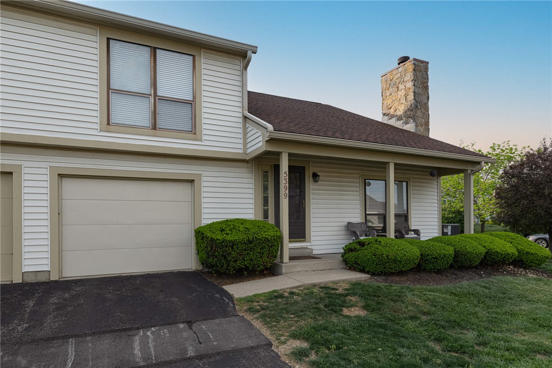 5399 Country Ridge Drive Mason, OH 45040 - Photo 28 of 29 This inviting home presents a welcoming facade with a well-maintained driveway and classic architectural details.