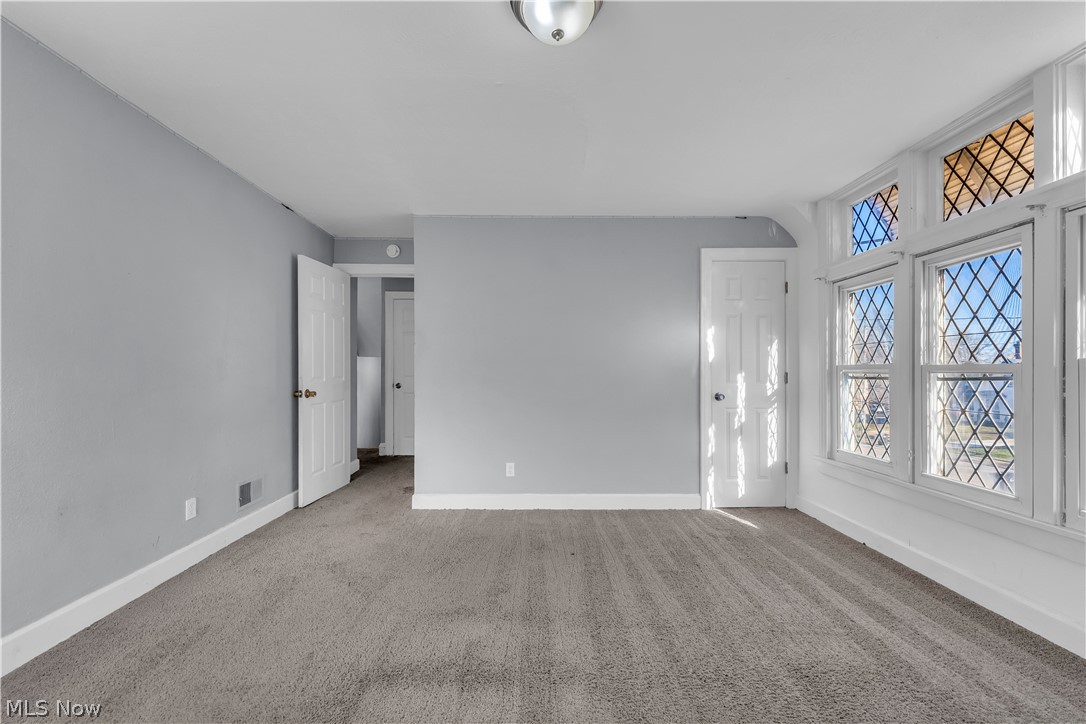 1858 Rudwick Road Cleveland, OH 44112 - Photo 17 of 36 Spare room featuring light carpet and baseboards