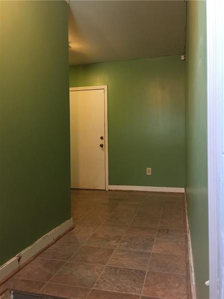 606 New Castle Road Butler, PA 16001 - Photo 11 of 21 Large entry way from garage - white door leads to the side porch