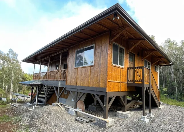 a view of house with backyard