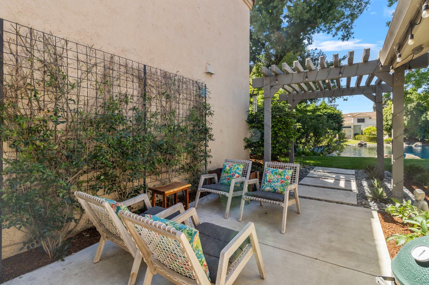 1013 Copper Lake Court Modesto, CA 95355 - Photo 40 of 66 a view of a patio with table and chairs and potted plants
