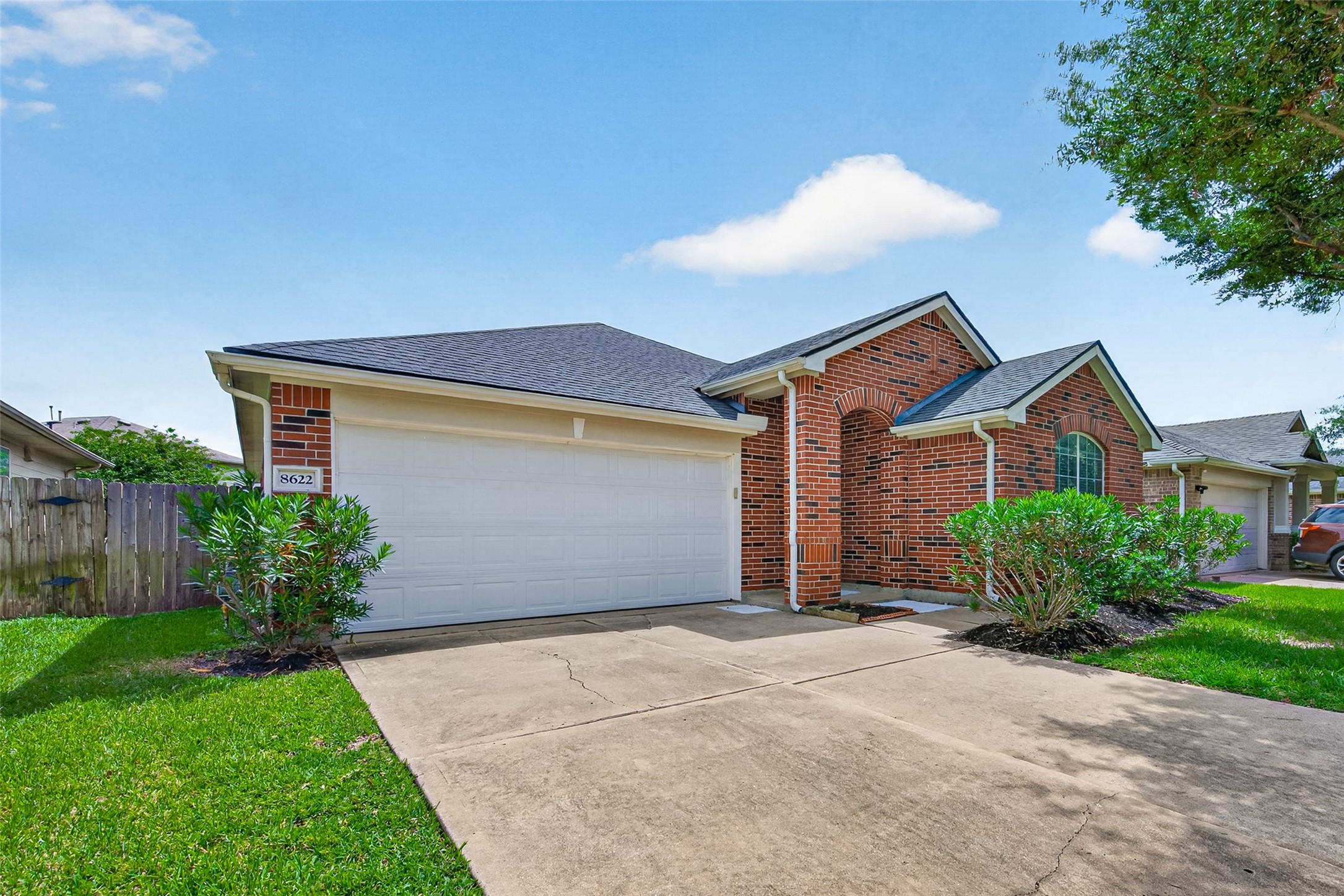 8622 Henrico Lane Rosenberg, TX 77469 - Photo 20 of 20 This charming brick home features a well-maintained exterior, attached two-car garage, and neatly landscaped front yard with lush greenery. Ideal for comfortable suburban living.