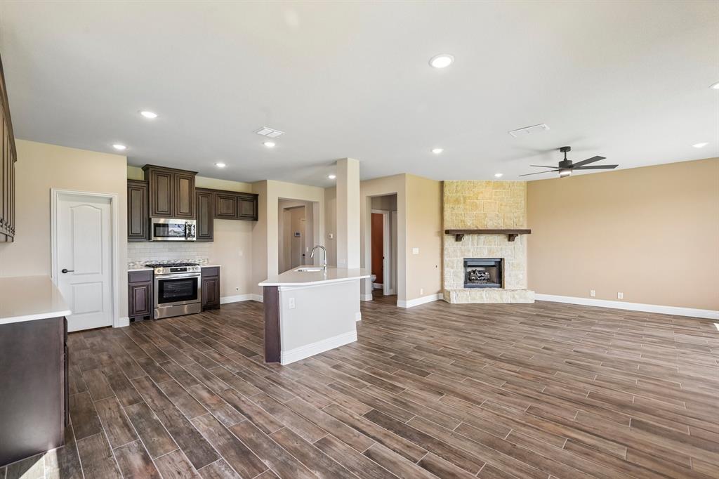 1228 Abbeygreen Road Forney, TX 75126 - Photo 12 of 31 Open concept kitchen and living room