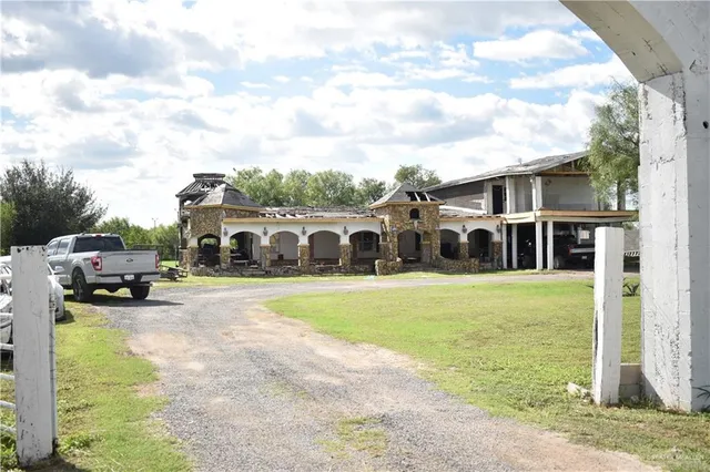 a view of a swimming pool and a yard