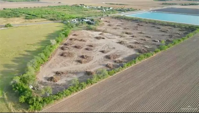 a front view of house with yard and entertaining space