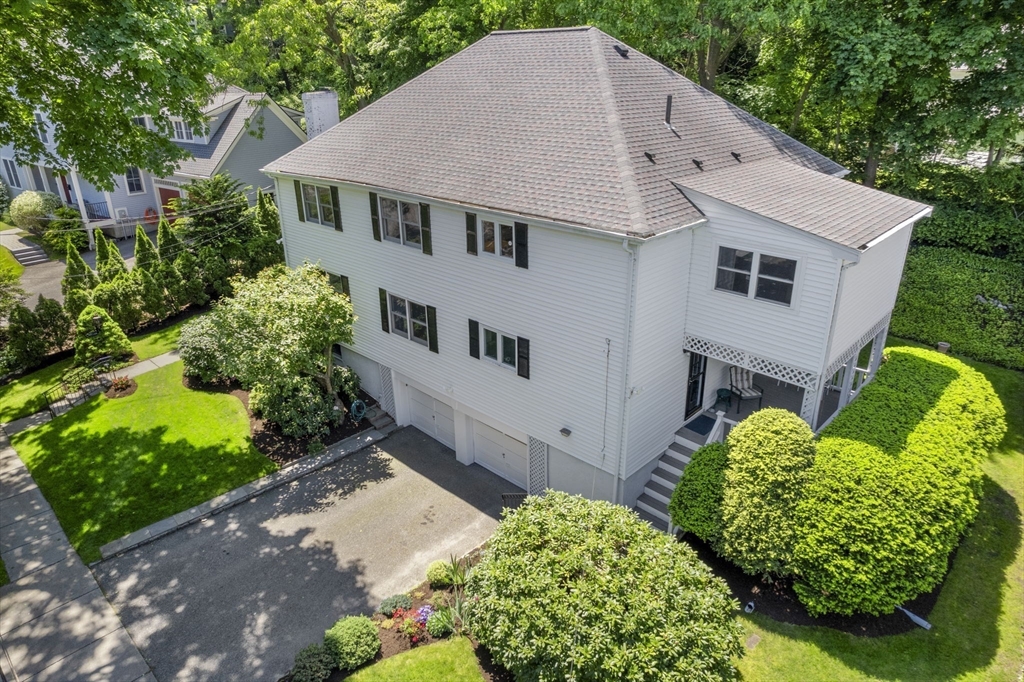 127-129 Withington Road Newton, MA 02460 - Photo 3 of 33 a aerial view of a house with a yard and plants