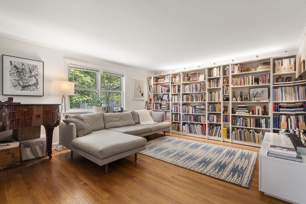 127-129 Withington Road Newton, MA 02460 - Photo 7 of 33 a living room with furniture and a book shelf