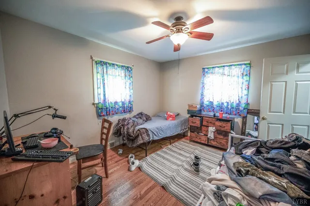 a bedroom with furniture and a window