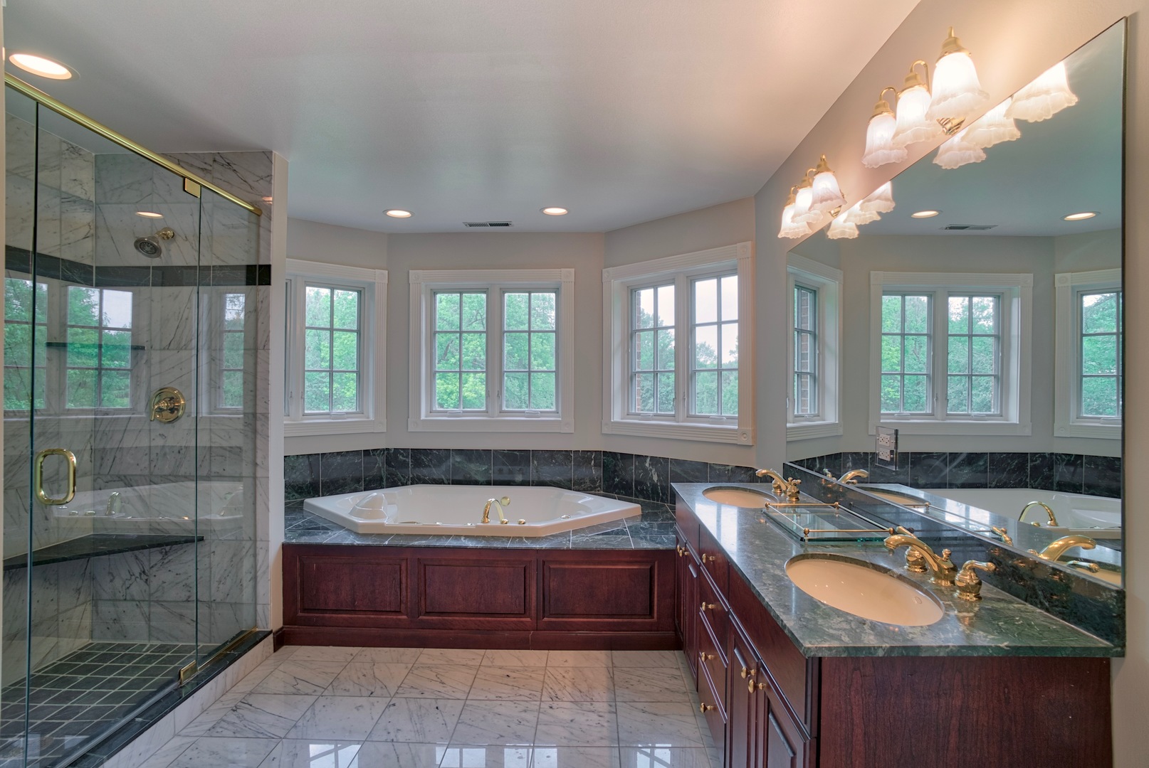 1830 Telegraph Road Lake Forest, IL 60045 - Photo 18 of 31 a spacious bathroom with a tub a double vanity sink a mirror and a shower