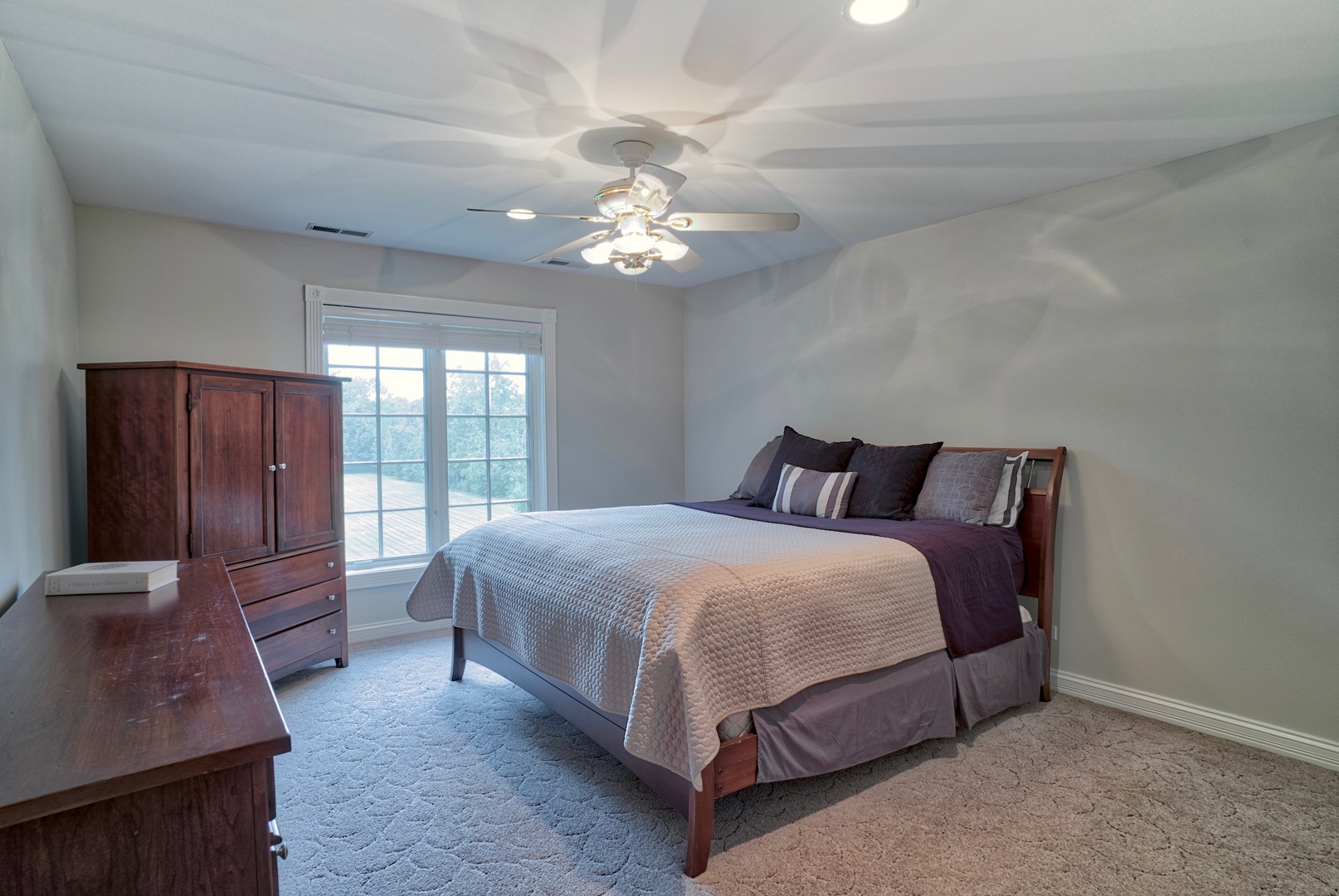 1830 Telegraph Road Lake Forest, IL 60045 - Photo 20 of 31 a spacious bedroom with a bed and a chandelier